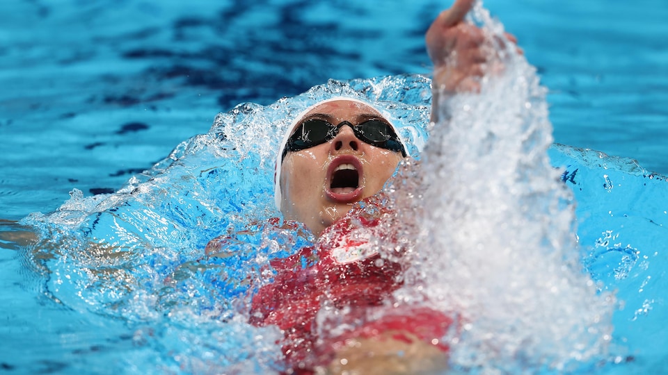 Close-up of a female swimmer in open-mouth backstroke