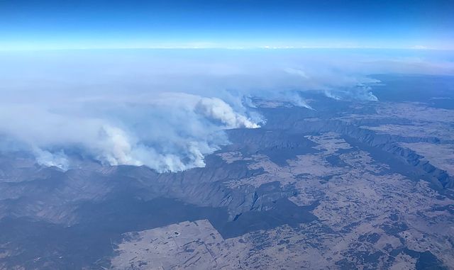 Smoke rises from a brush fire in Australia in November 2019. [TOM BANNIGAN - AFP]