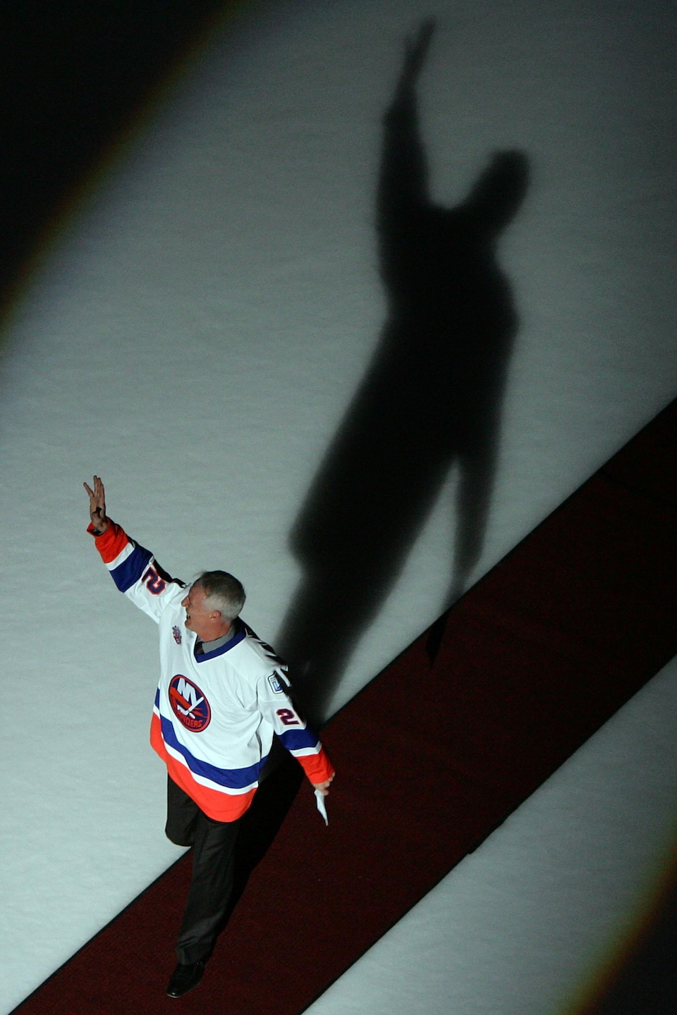 A man waves to the crowd.