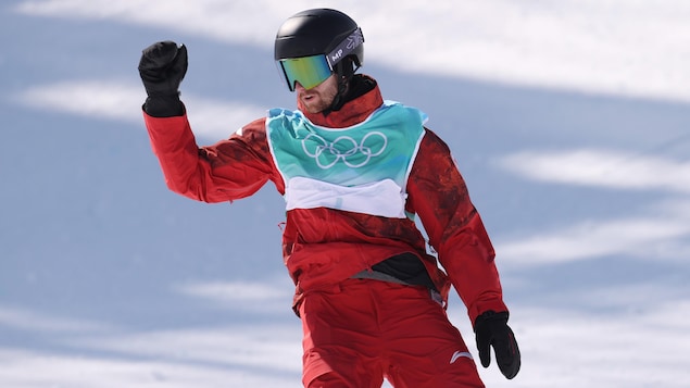 Max Parrott completes his big snowboarding descent during the Beijing Olympics.