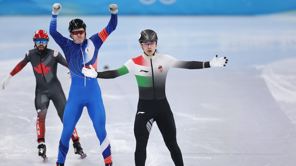 Three cheerful skaters after their race.