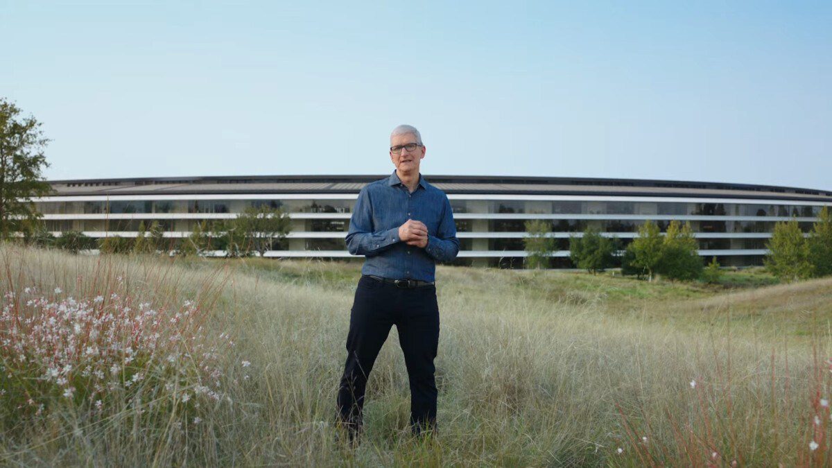 Tim Cook in a field near Apple Park