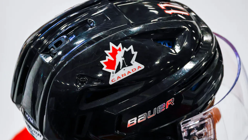 Close-up of a black hockey helmet with the Hockey Canada logo.